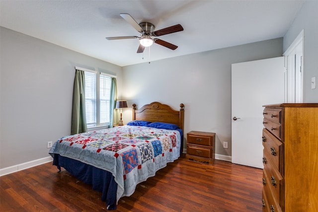 bedroom with ceiling fan and dark hardwood / wood-style flooring