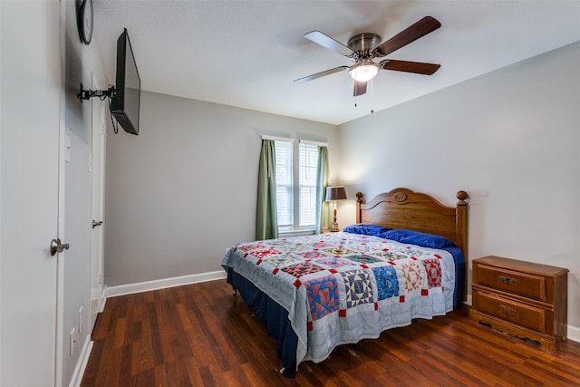 bedroom with ceiling fan and dark hardwood / wood-style flooring