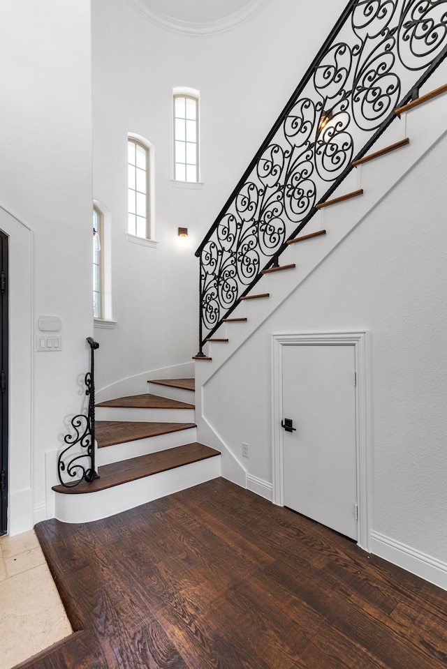 stairway featuring hardwood / wood-style floors