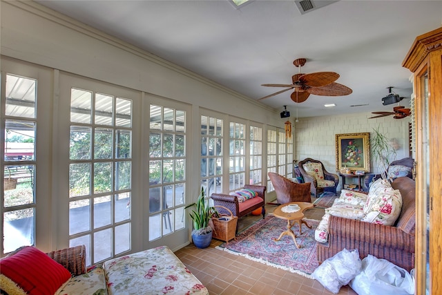 sunroom / solarium with ceiling fan and plenty of natural light