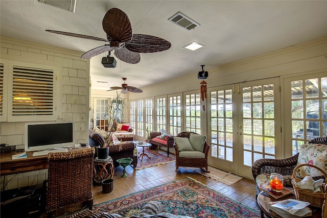 interior space featuring ceiling fan and french doors