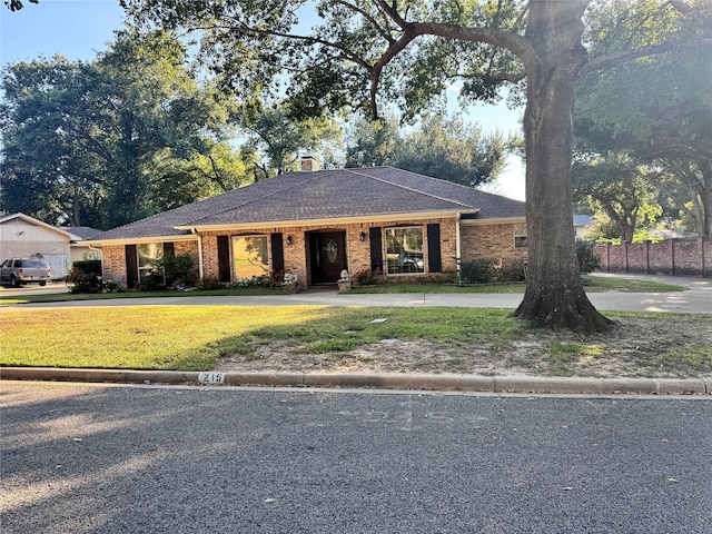 ranch-style home with a front yard