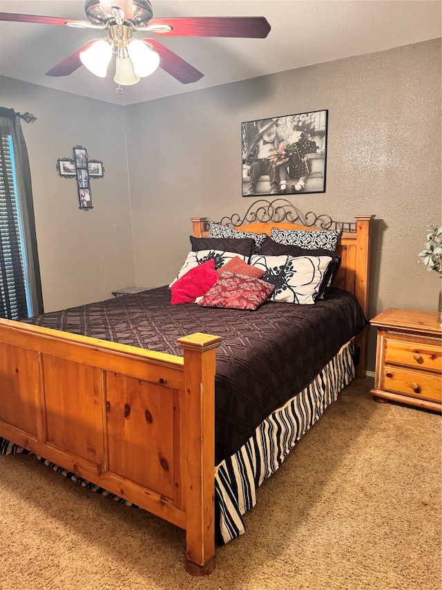 bedroom featuring ceiling fan and carpet flooring