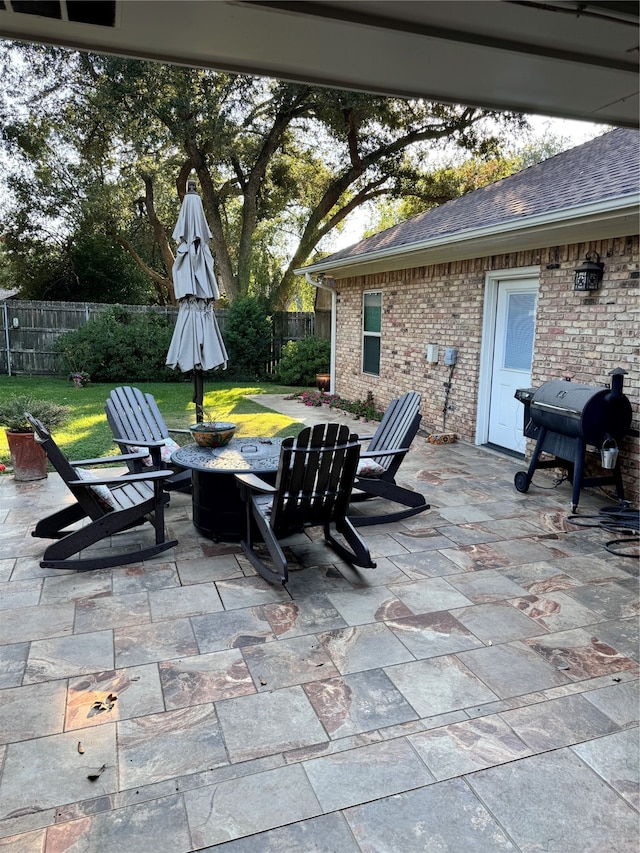 view of patio with a fire pit