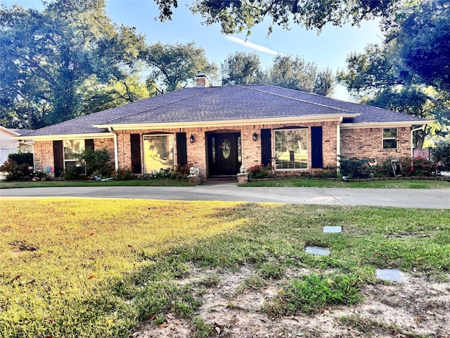 ranch-style house with a front yard