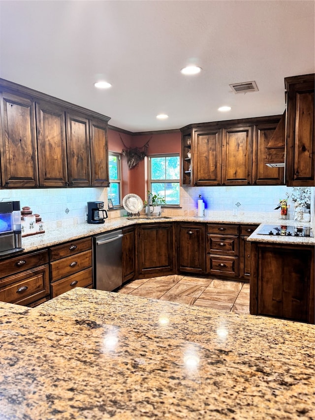 kitchen featuring black electric cooktop, light stone countertops, dark brown cabinetry, and dishwasher