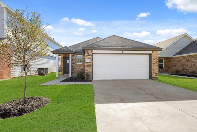 view of front of house with central AC, a garage, and a front lawn