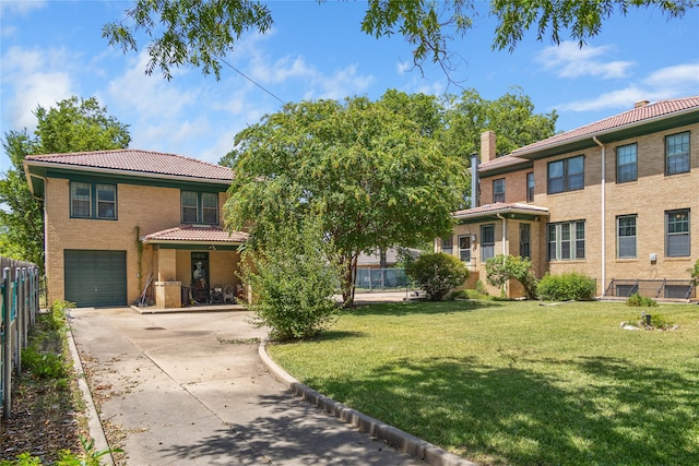 view of front of property with a garage and a front yard