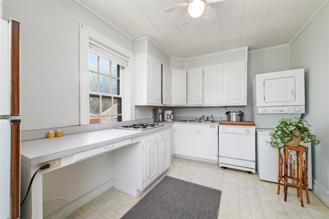 kitchen with stacked washer and clothes dryer, white cabinetry, ceiling fan, and white dishwasher