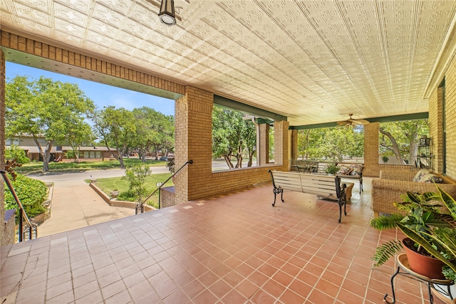 view of patio featuring ceiling fan