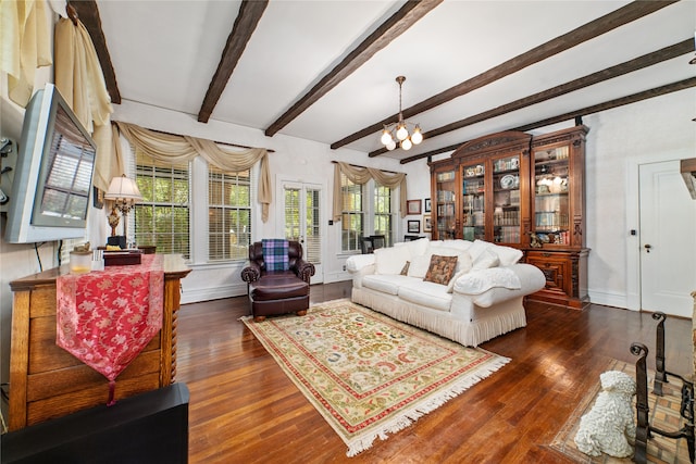 living room featuring beamed ceiling and dark hardwood / wood-style floors