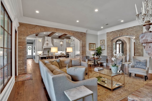 living room featuring ornamental molding and hardwood / wood-style flooring