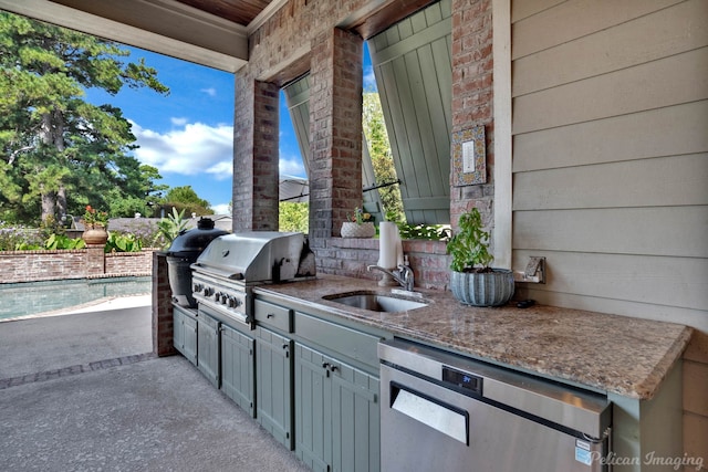 view of patio featuring area for grilling, grilling area, and sink