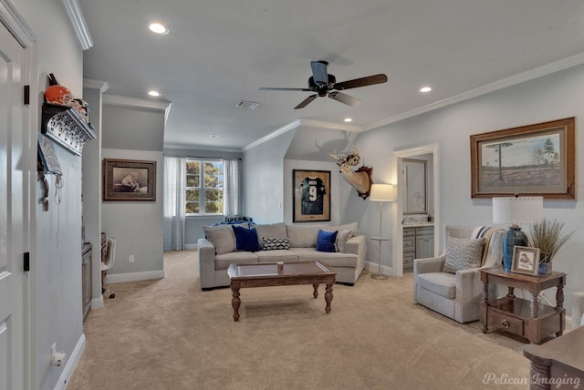 living room with ornamental molding, ceiling fan, and light colored carpet