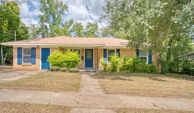 ranch-style house with a front lawn and a porch