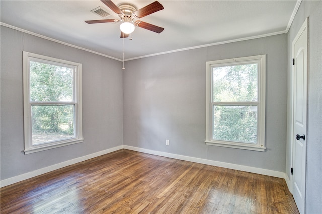 unfurnished room featuring ceiling fan, crown molding, wood-type flooring, and a wealth of natural light