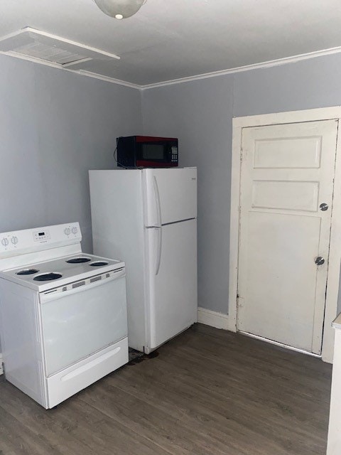 kitchen with ornamental molding, white appliances, and dark hardwood / wood-style floors