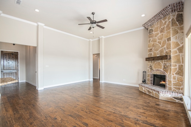 unfurnished living room with ceiling fan, a fireplace, dark hardwood / wood-style floors, and crown molding