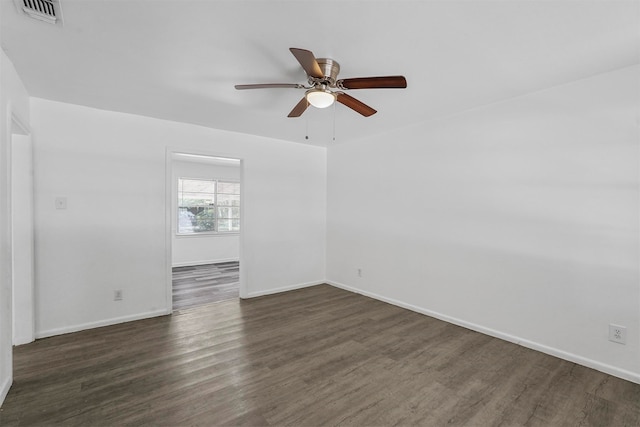 unfurnished room with ceiling fan and dark hardwood / wood-style flooring