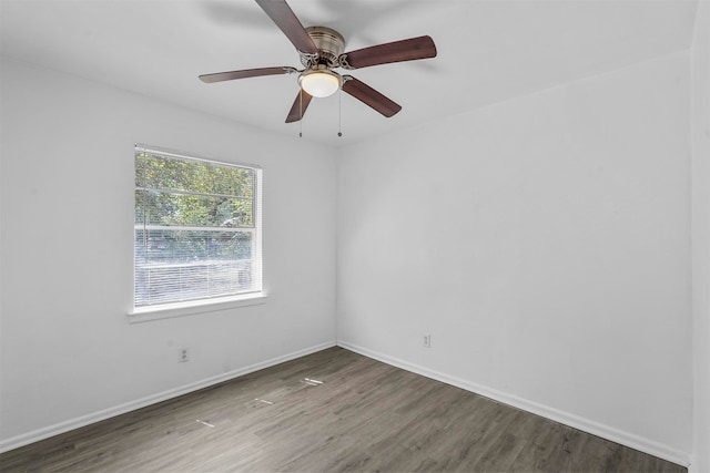 unfurnished room featuring dark hardwood / wood-style flooring and ceiling fan