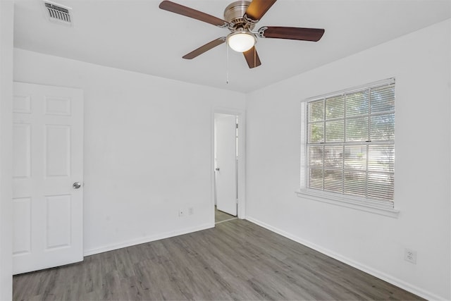 spare room featuring ceiling fan and hardwood / wood-style flooring