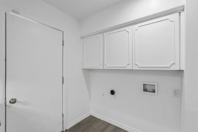 laundry area with washer hookup, cabinets, dark hardwood / wood-style flooring, and electric dryer hookup