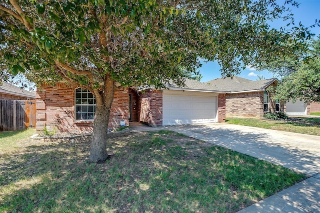 view of front of house with a garage and a front lawn