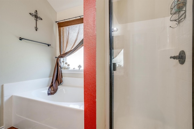 bathroom with shower with separate bathtub