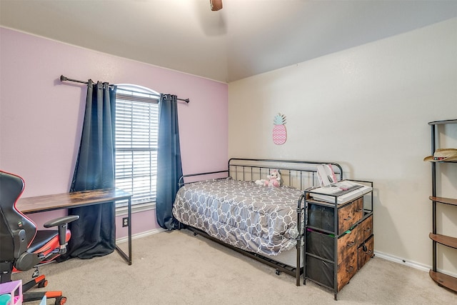 bedroom featuring light carpet and ceiling fan