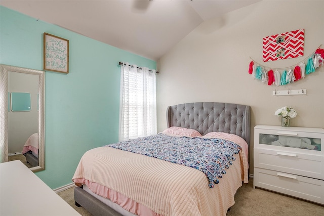 bedroom with lofted ceiling, ceiling fan, and carpet flooring