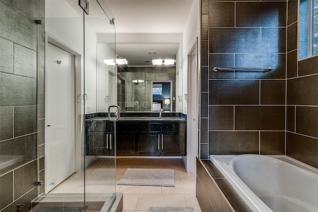 bathroom with plus walk in shower, tile patterned flooring, and vanity