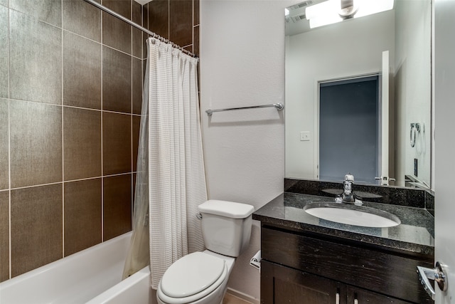 full bathroom with shower / bath combination with curtain, vanity, and toilet