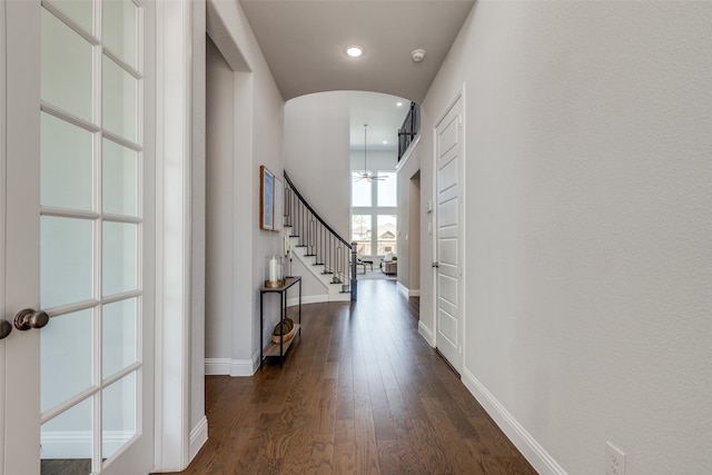 corridor featuring dark wood-type flooring