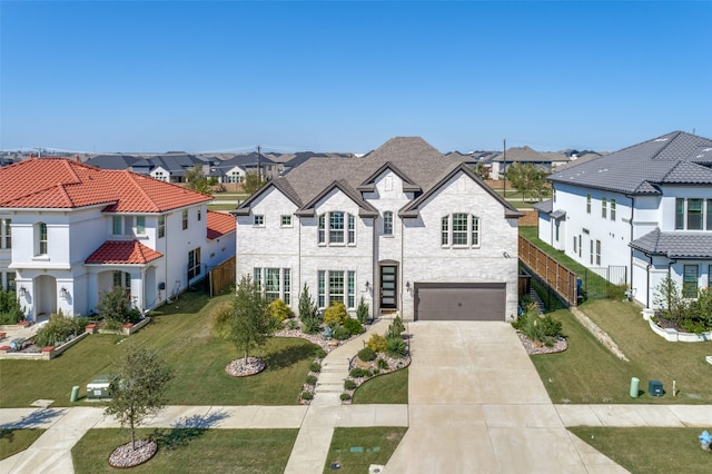 view of front of home featuring a garage and a front lawn