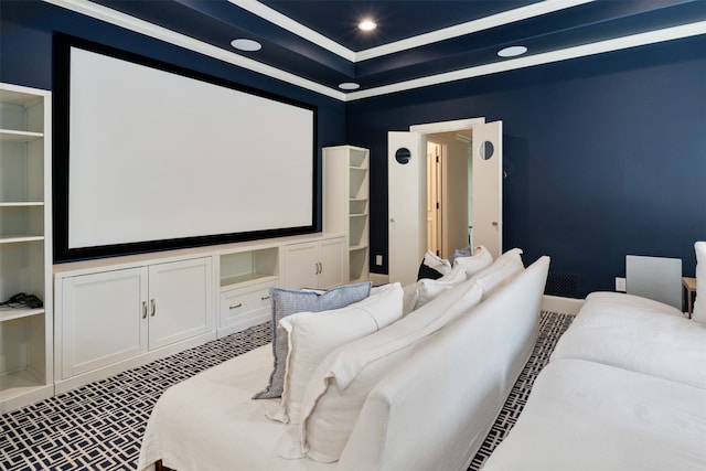 cinema featuring carpet, built in shelves, and a raised ceiling