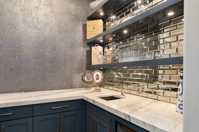 bar with tasteful backsplash and sink