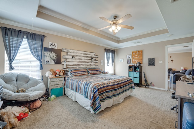 bedroom featuring carpet floors, a raised ceiling, ceiling fan, and ornamental molding