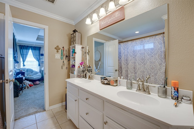 bathroom featuring vanity, tile patterned floors, and crown molding