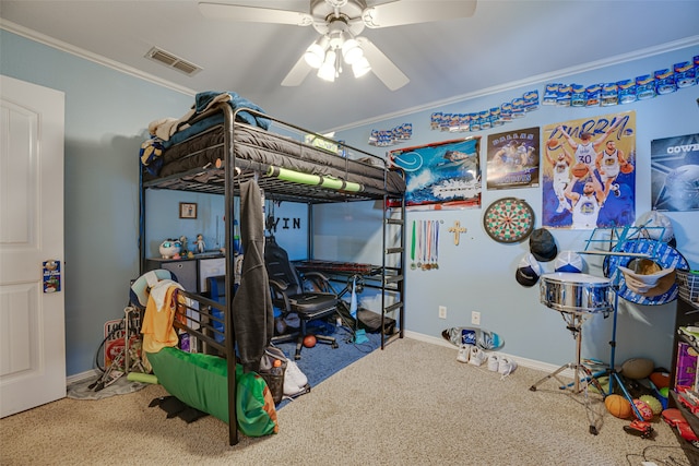 carpeted bedroom featuring ceiling fan and ornamental molding