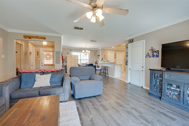 living room featuring crown molding, light hardwood / wood-style floors, and ceiling fan with notable chandelier