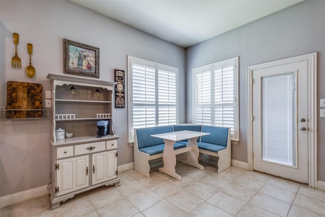 dining area featuring light tile patterned flooring