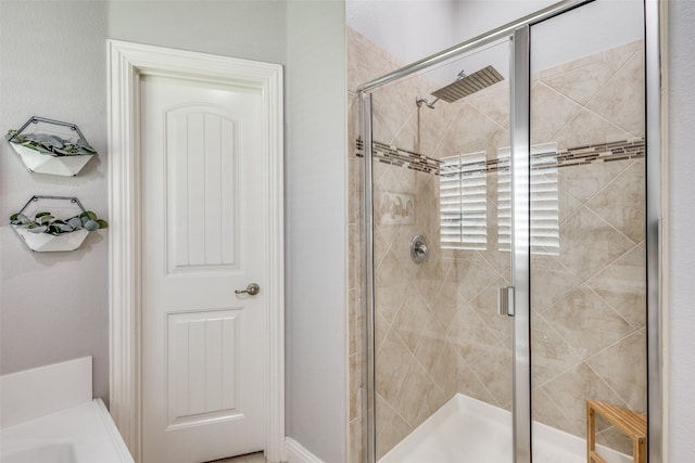 bathroom with a shower with shower door