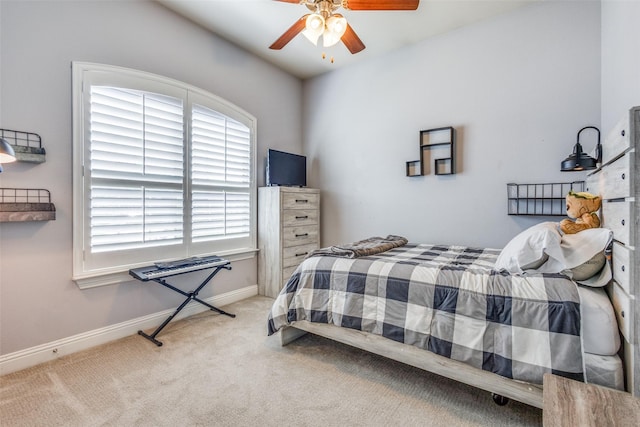 carpeted bedroom with ceiling fan and lofted ceiling