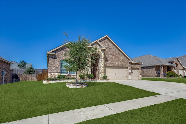 view of front of property featuring a garage and a front lawn