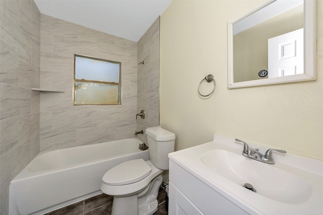 full bathroom with vanity, toilet, and tiled shower / bath