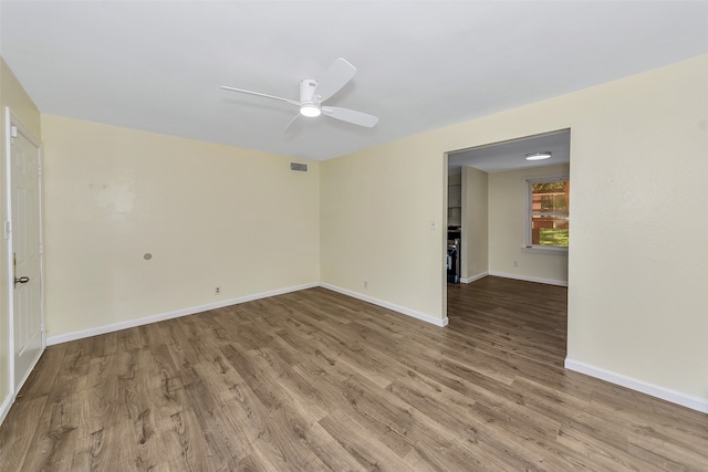 spare room with ceiling fan and hardwood / wood-style floors