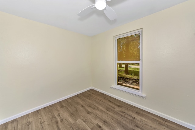 spare room with wood-type flooring and ceiling fan