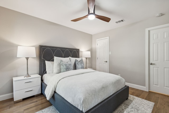 bedroom with ceiling fan and hardwood / wood-style floors