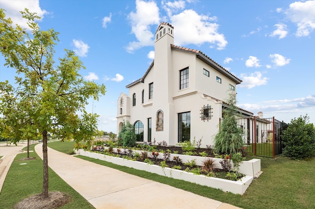 view of home's exterior with a yard