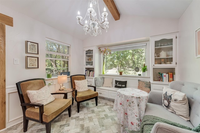 sitting room with lofted ceiling with beams and a notable chandelier